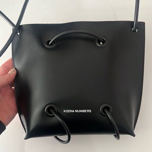 Kozha Numbers Utility Crossbody